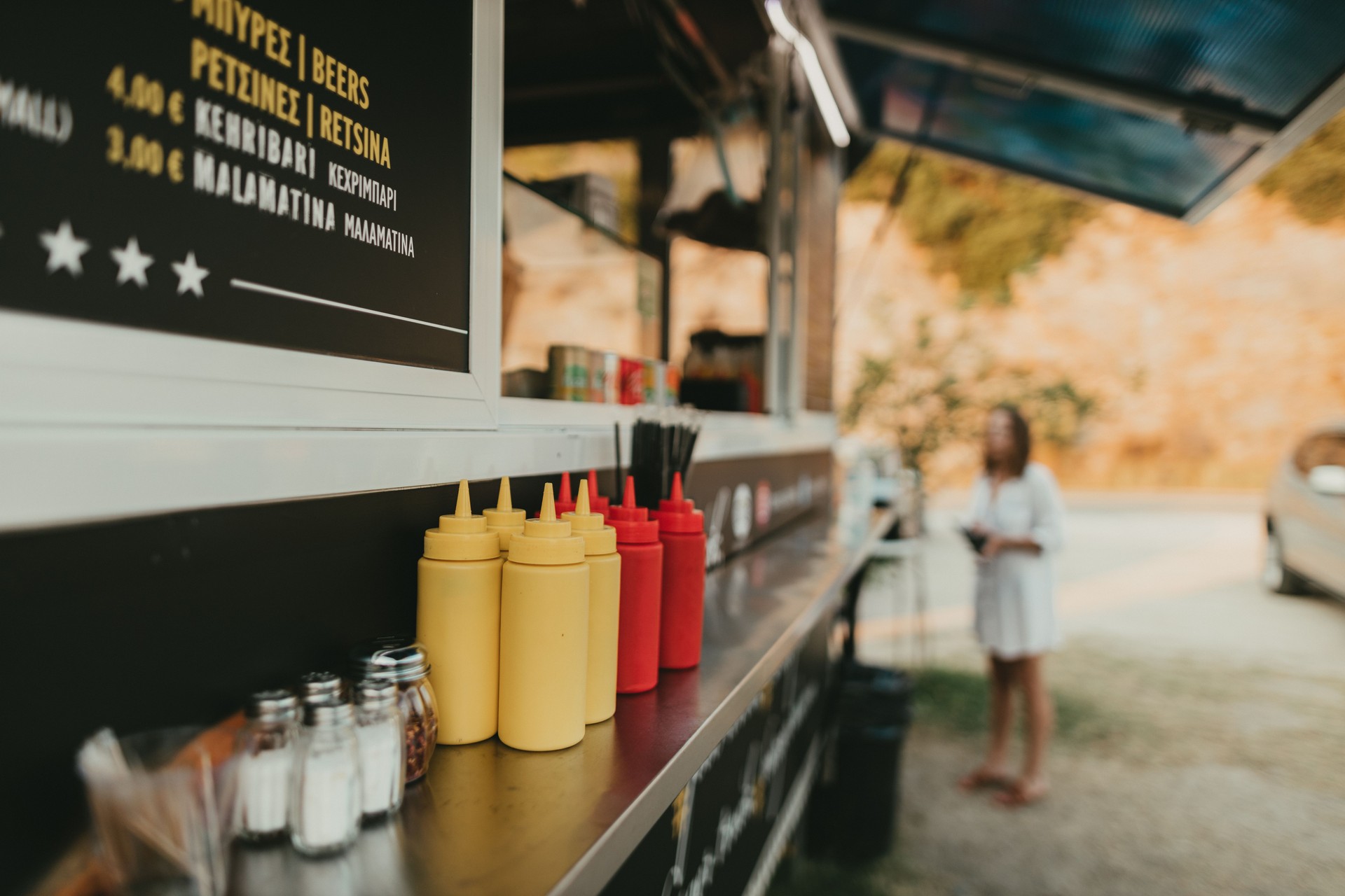 Mayo and ketchup bottles at the food truck window